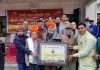 Dogri Bhasha Academy presenting a memento to Sham Lal Sharma during literary programme at Akhnoor on Monday.