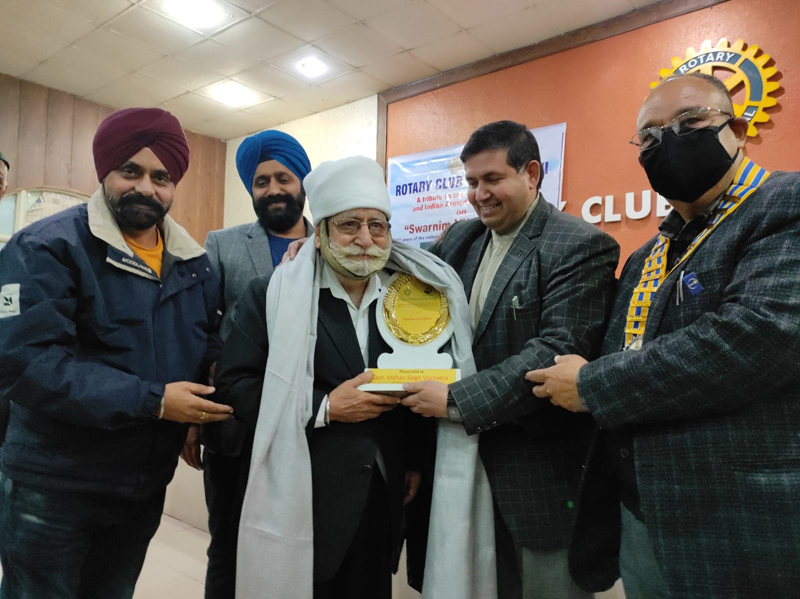 Office bearers of Rotary Club Jammu Tawi felicitating a hero of 1971 Indo-Pak war.
