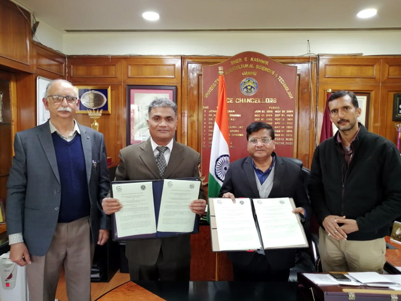 SKUAST VC displaying copies of MoU signed with ICAR AICRP-PHET Ludhiana.