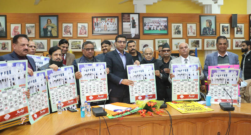 Dr. Shahid Iqbal Choudhary, Secy Tribal Affairs Dept along with others releasing annual calendar of GDCT Trust.