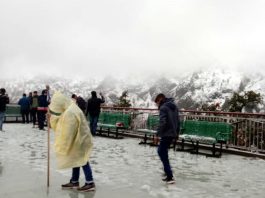 Mata Vaishnodevi shrine on Trikuta hills experiences season’s first snowfall on Friday. — Excelsior/Romesh Mengi