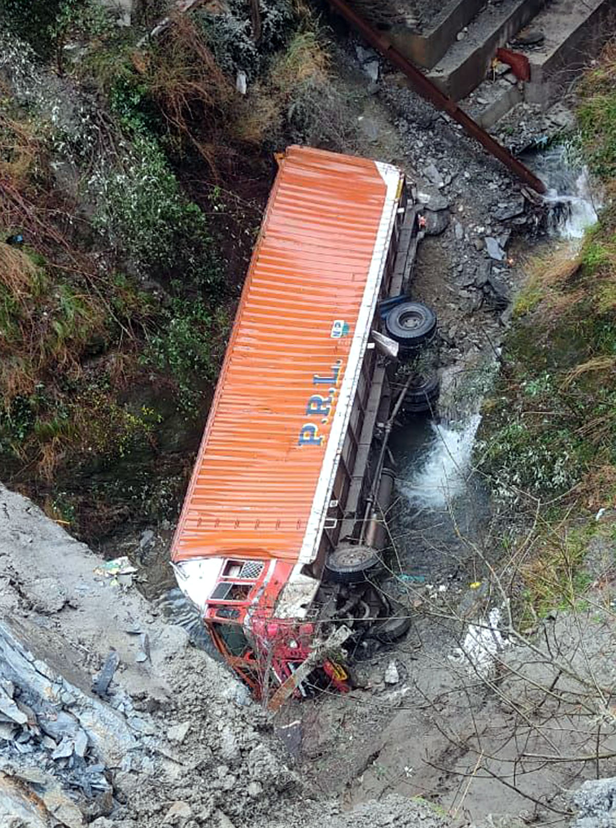 Ill-fated truck lying in gorge. —Excelsior/Pervaiz