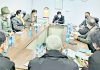 Divisional Commissioner chairing a meeting on Friday.
