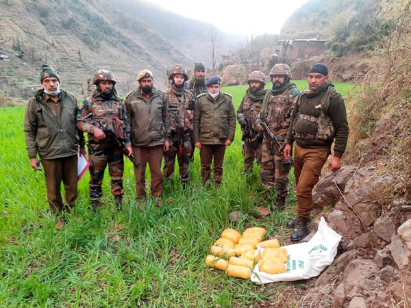 Army recovers a huge consignment of narcotics near LoC in Poonch on Friday. (UNI)