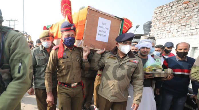 DGP and other police officers taking martyr Rohit’s body for cremation at Jogi Gate, Jammu on Thursday. —Excelsior/ Rakesh