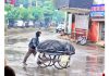 A man pushes his wheel cart during rains in Jammu. -Excelsior/Rakesh