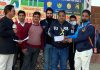A player being awarded with man of the match trophy by dignitaries at Kathua.