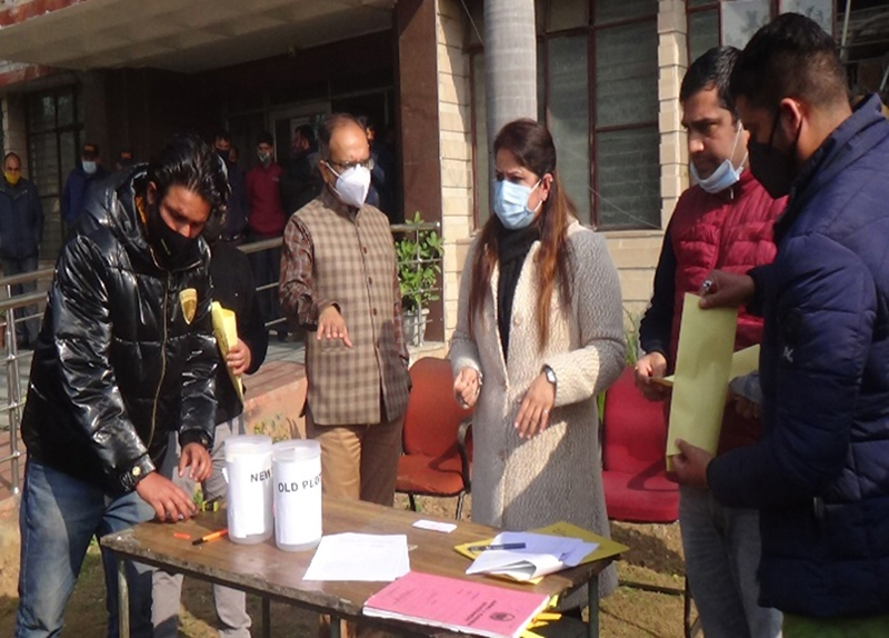 JDA officers during a draw of lots being held at Vikas Bhawan, Jammu on Friday.