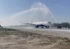 IAF giving water cannon salute to first flight traversing through extended runway at Jammu Airport on Friday.