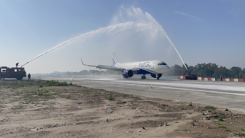 IAF giving water cannon salute to first flight traversing through extended runway at Jammu Airport on Friday.