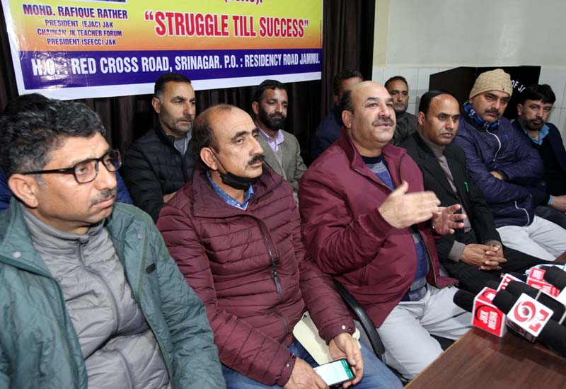 EJAC president, Mohd Rafique Rather, flanked by others addressing press conference in Jammu on Thursday. -Excelsior/Rakesh