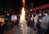 People celebrating Lohri outside Raghunath Mandir in Jammu on Thursday. — Excelsior/Rakesh