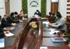 Divisional Commissioner chairing a meeting on Sunday.