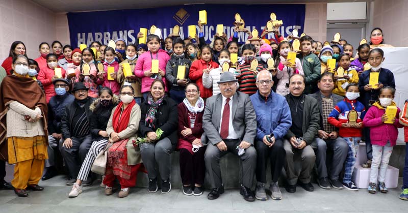 Children and their parents during silver jubilee function of HBET in Jammu on Thursday.
