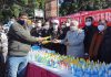 NC leaders distributing free masks and hand sanitizers in Jammu on Tuesday.
