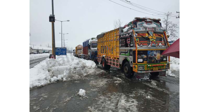 Trucks stranded in Qazigund area after closure of Jammu-Srinagar highway on Wednesday. -Excelsior/Sajjad Dar