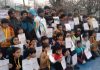 Winners displaying meritorious certificates at Srinagar.