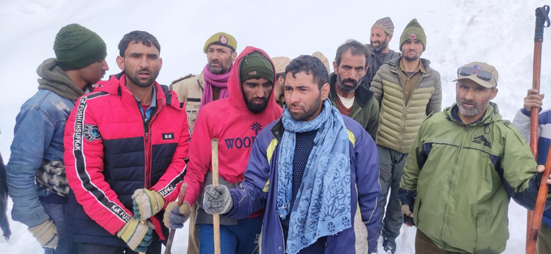Missing persons being rescued by police and locals in Warwan area of Kishtwar on Friday.