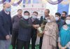 SKUAST-Jammu VC distributing fruit plants to farmers during a programme in Samba village on Wednesday.