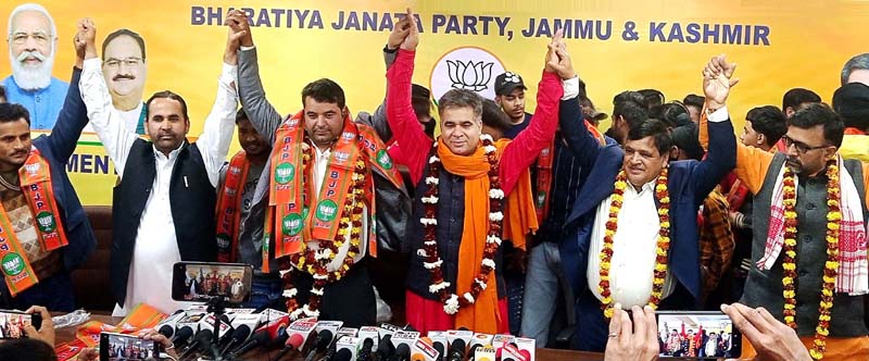 J&K BJP President Ravinder Raina welcoming Mubashir Azad into party fold on Sunday.
