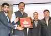 CEO of FastBeetle Sheikh Samiullah presenting a souvenir to Principal Secretary, Industries and Commerce at Jammu.