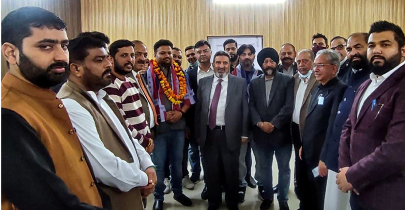 Apni party president Altaf Bukhari and new entrants posing for group photograph in Jammu on Saturday.