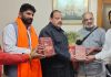 Senior BJP leader Devender Singh Rana releasing Shrimad Bhagwad Gita.