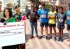 Manminder Kaur getting award (L) and participants of the Marathon from Jammu (R).