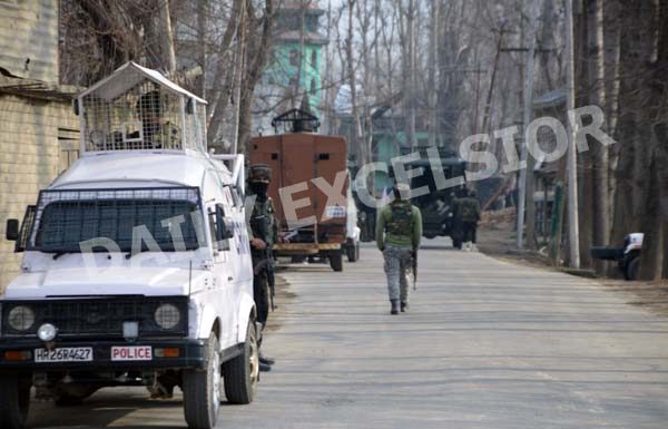 Security forces near encounter site at Naina Batapora in Pulwama. -Excelsior/Younis Khaliq