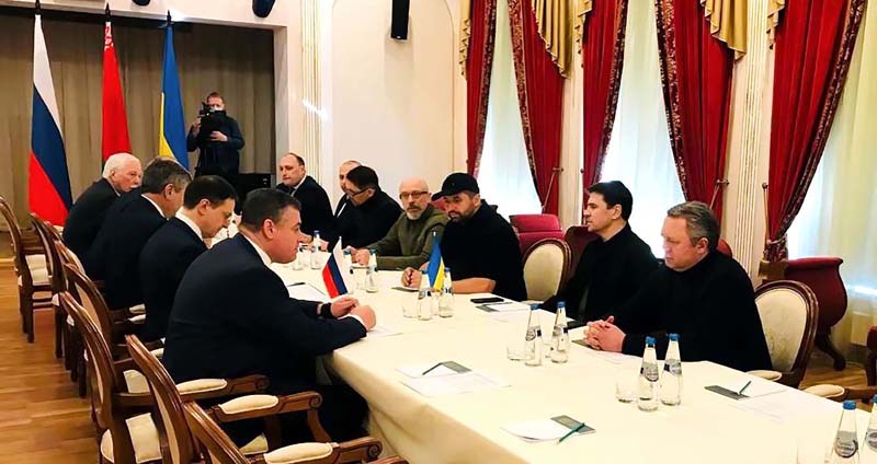 Russian and Ukrainian delegations during a meeting for negotiations between two countries, at Belarusian border city of Gomel on Monday. (UNI).
