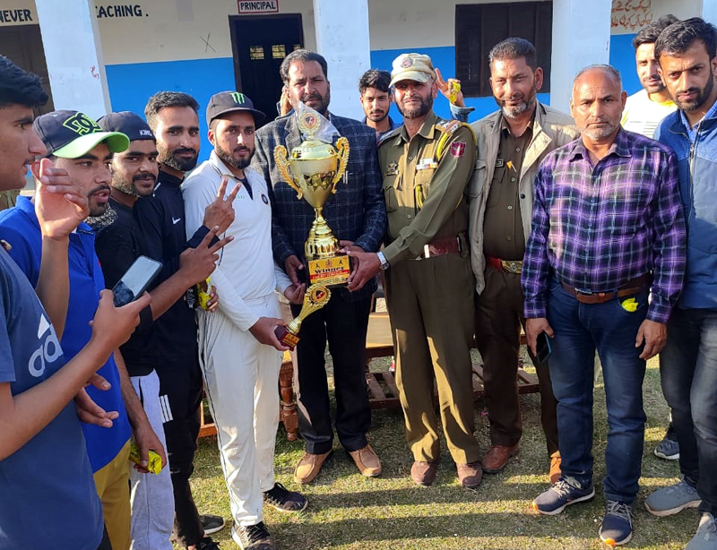 Winning team being awarded with a trophy by dignitaries at Peeri Rajouri on Friday.