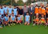 Winning team posing for a group photograph with dignitaries at K K Hakku Stadium Jammu on Monday.