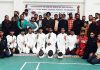 Winners posing for a group photograph with dignitaries at Reasi on Wednesday.