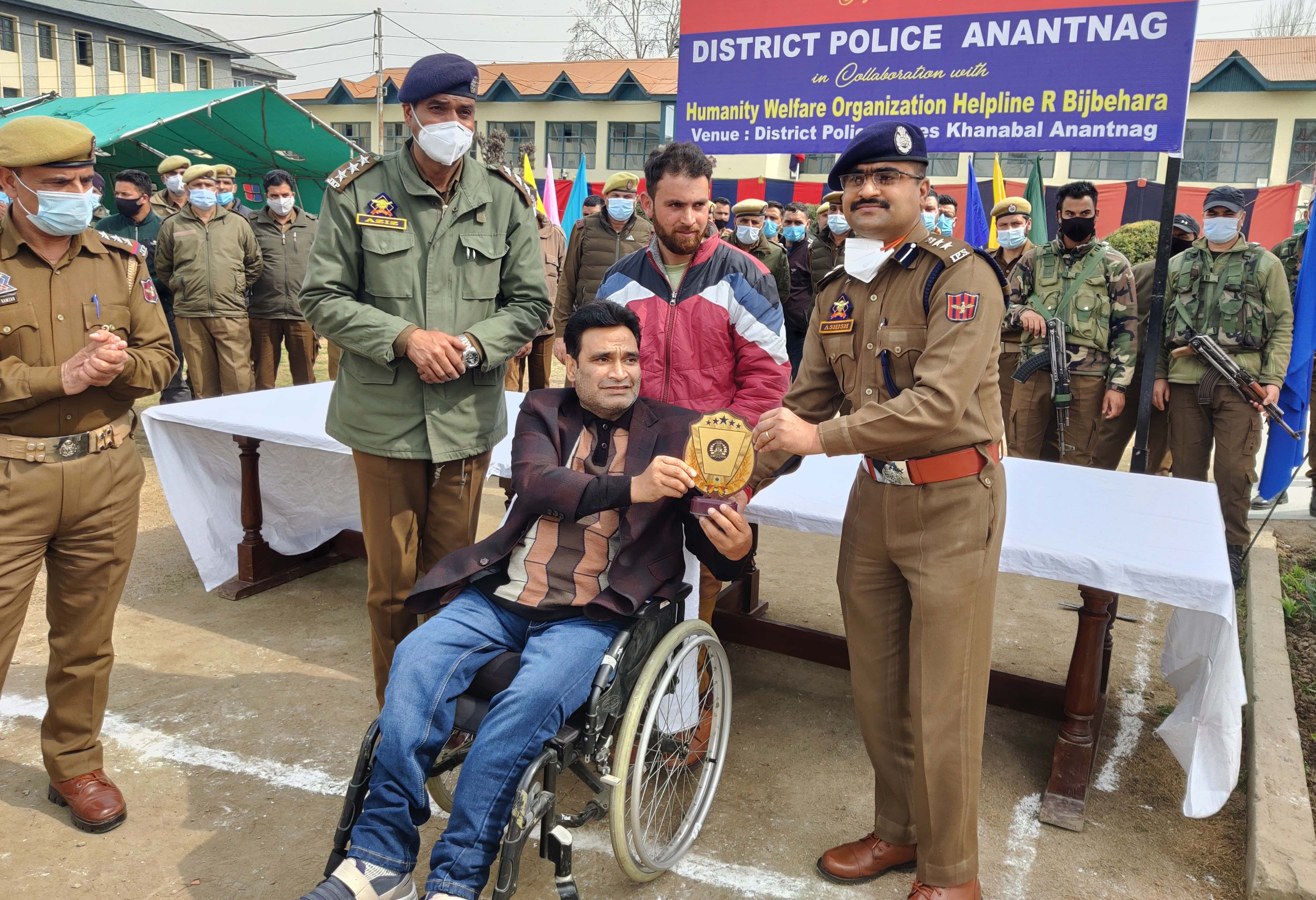 A participant being awarded by the Police officer at DPL Anantnag on Saturday.