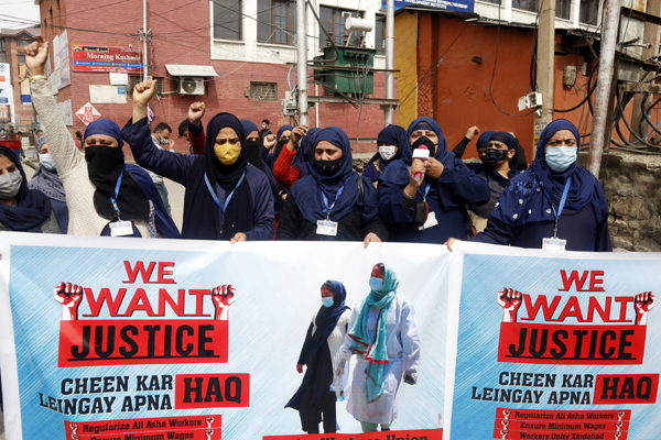 ASHA workers during a protest in Srinagar on Saturday. -Excelsior/Shakeel