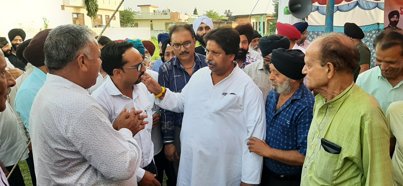 JKPCC working president, Raman Bhalla interacting with people at Gadigarh in Jammu on Wednesday.