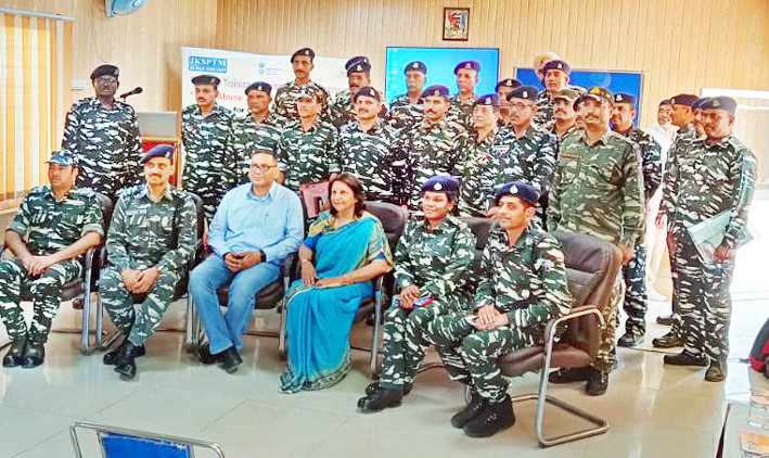 CRPF officers and officials posing with resource person Dr Chand Trehan during a training program in Jammu.