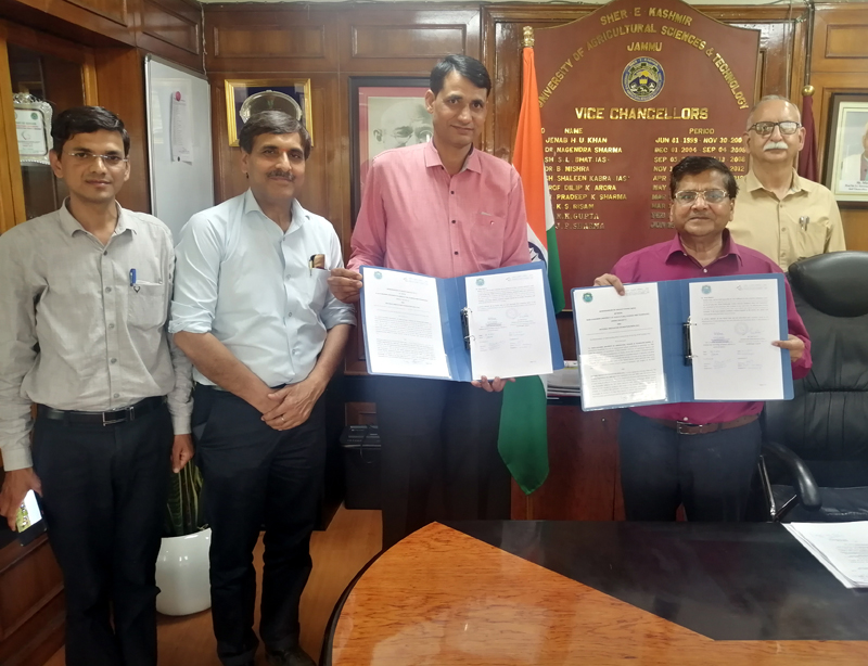 Representatives of SKUAST-J and NIF displaying the copies of MoU signed by the two organisations at Gandhi Nagar, Gujarat on Friday.