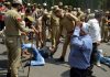 PHE workers protesting for their wages being lathi-charged by policemen in Jammu on Monday. -Excelsior/ Rakesh