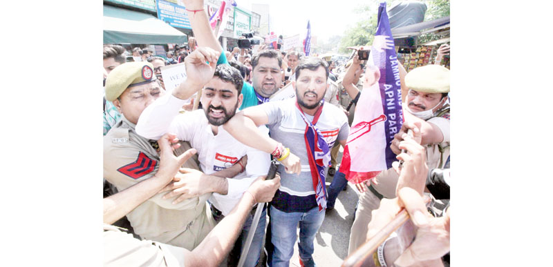 Apni Party Youth Wing workers jostling with police during protest at Jammu on Friday. -Excelsior/Rakesh