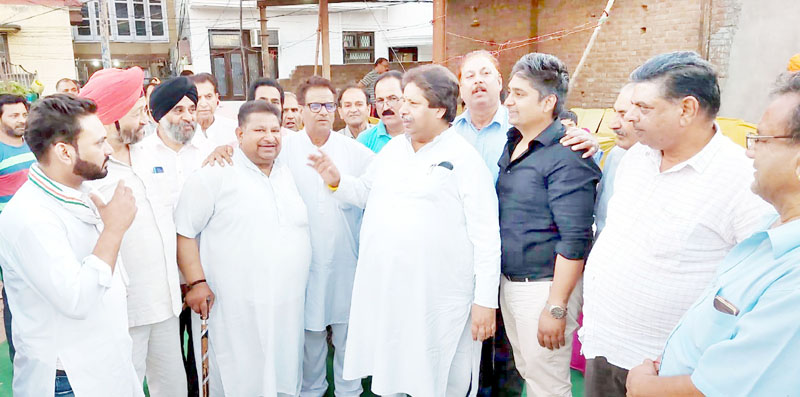 Cong leader Raman Bhalla interacting with prominent persons at R S Pura on Friday.