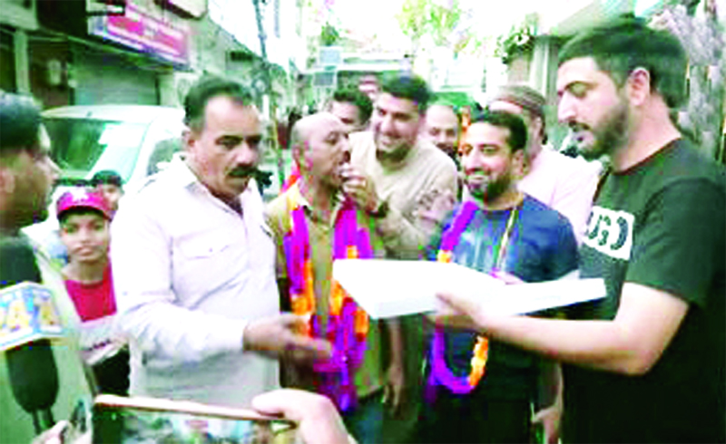 Umran Malik’s father celebrating along with family members and friends on selection of his son in Indian team squad at Jammu on Sunday.