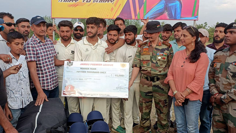 Winning team being awarded by an Army officer and other dignitaries at Country Cricket Stadium, Gharota in Jammu.