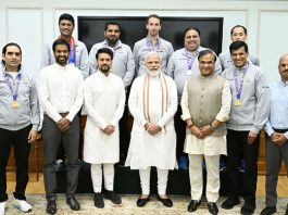 Prime Minister Narendra Modi posing with the victorious Indian badminton contingent for Thomas and Uber cup, in New Delhi on Sunday.