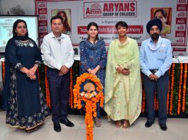 A team of Aryans Group of Colleges posing for a group photograph before a seminar in Rajpura.