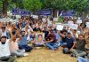 Reserved category employees posted in Kashmir, staging protest at Panama Chowk in Jammu on Saturday.