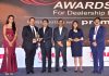 Office bearers of Jammu Motors getting ‘Dealership Excellence Award’ from dignitaries at Mumbai on Sunday.
