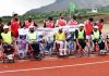 Para-athletes posing for a group photograph during the meet at IUST Ground Srinagar on Monday.