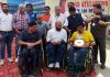Wheelchair cricketers posing alongwith Brig Anil Gupta during flag off ceremony in Jammu on Thursday.
