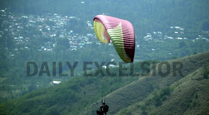 Tourists enjoying paragliding in Srinagar. -Excelsior/Shakeel